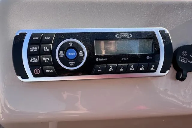 Slide: The Image of Jensen audio system on 2018 Sun Tracker SportFish 22 DLX boat dashboard. - 20