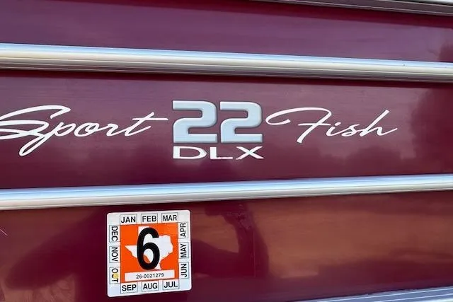 Slide: The Image of 2018 Sun Tracker SportFish 22 DLX boat with registration sticker. - 8