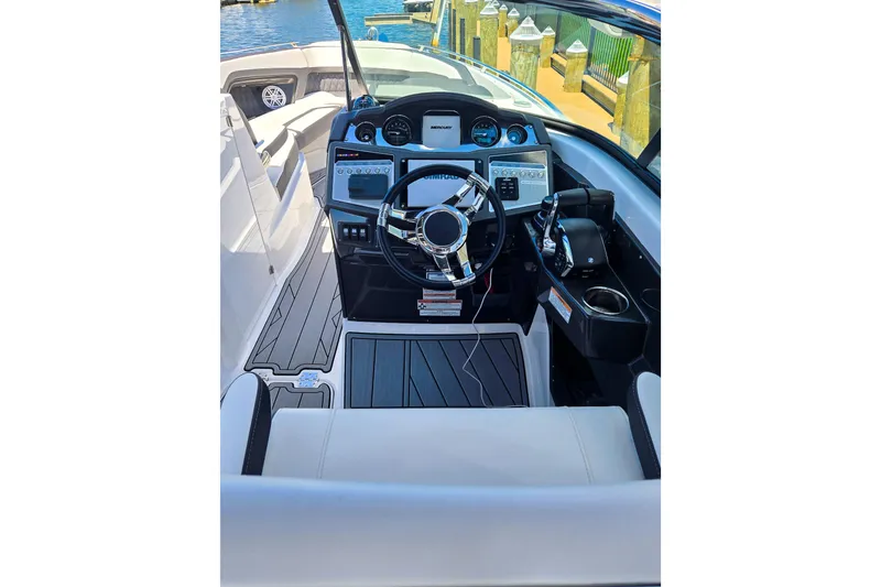 Slide: The Image of 2024 Monterey 305SS Super Sport boat cockpit with modern steering and controls. - 7