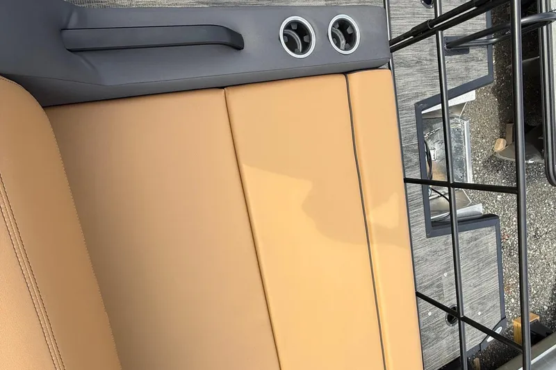 Slide: The Image of Interior of 2026 Viaggio Lago Z22S-CC with tan seating and cup holders. - 16