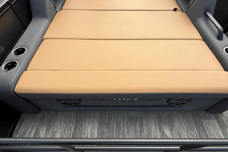 Slide: The Image of 2026 Viaggio Lago Z22S-CC boat interior with tan seating and cup holders. - 20