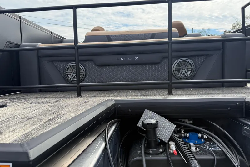 Slide: The Image of 2026 Viaggio Lago Z22S-CC boat deck with speakers and railing, showcasing modern design. - 3
