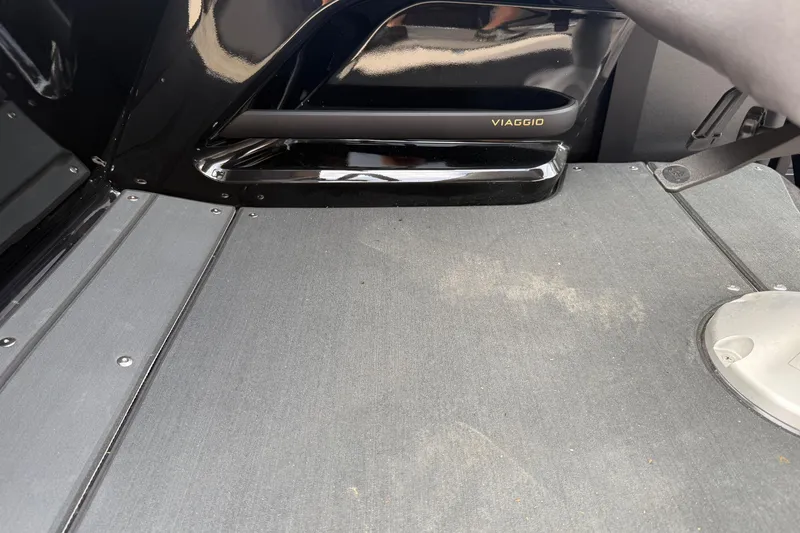 Slide: The Image of Interior of 2026 Viaggio Lago Z22S-CC boat, featuring sleek black design and flooring. - 30