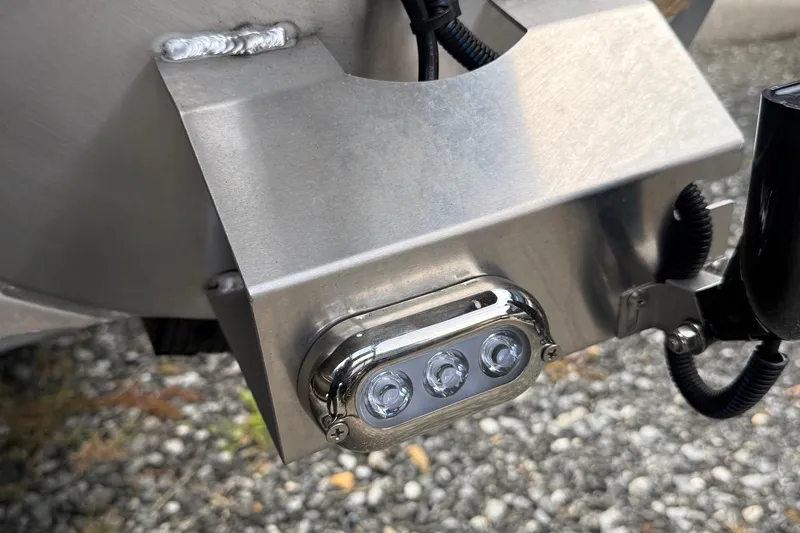 Slide: The Image of Close-up of Viaggio Lago Z22S-CC 2026 boat component with LED lights and metal casing. - 38