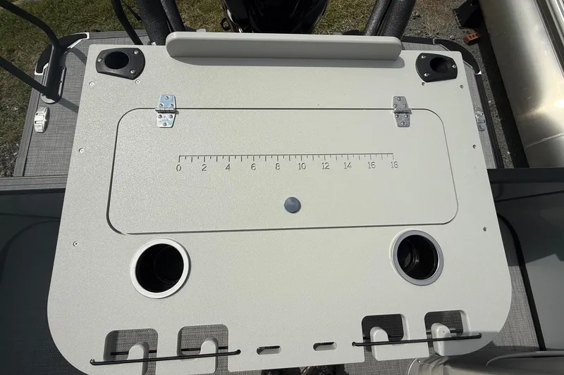 Slide: The Image of 2026 SLYVAN X-3 Party Fish boat deck with built-in measuring ruler and cup holders. - 19