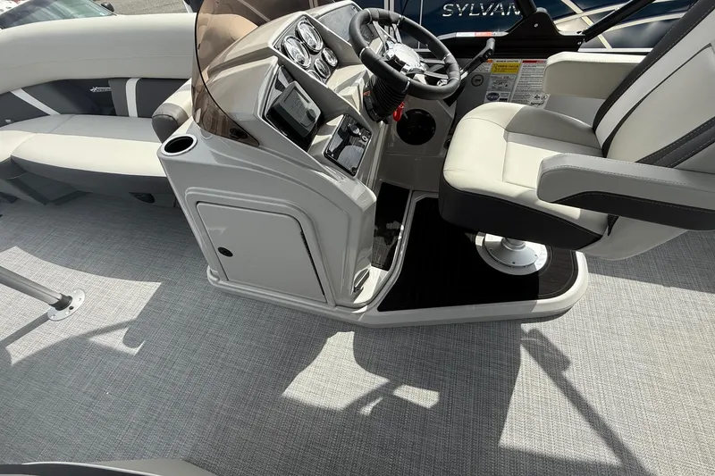 Slide: The Image of Interior of 2026 SLYVAN X-3 Party Fish boat with modern helm and seating. - 21