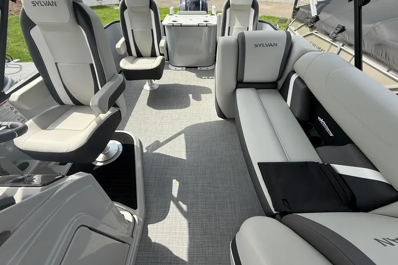 Slide: The Image of 2026 SLYVAN X-3 Party Fish boat interior with modern seating and sleek design. - 22