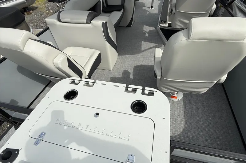Slide: The Image of Interior of 2026 SLYVAN X-3 Party Fish boat with comfortable seating and cup holders. - 4