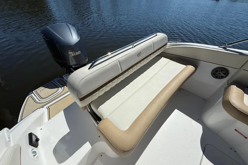 Slide: The Image of 2018 Cobalt 23SC boat interior with Yamaha 300 engine, featuring comfortable seating. - 8
