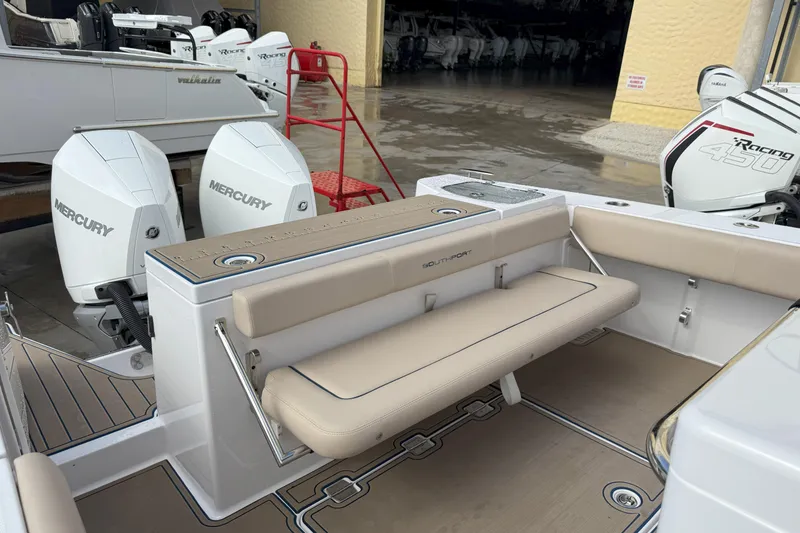 Slide: The Image of 2024 Southport 30 FE boat with Mercury engines and beige seating. - 14