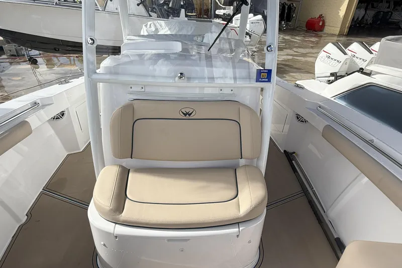 Slide: The Image of 2024 Southport 30 FE boat interior with beige seating and modern design. - 27