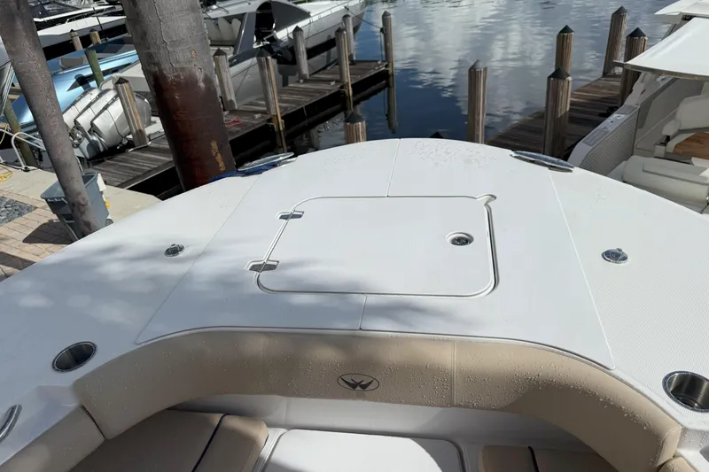 Slide: The Image of 2024 Southport 30 FE boat deck with seating, docked at marina. - 28