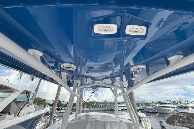 Slide: The Image of 2024 Southport 30 FE boat's blue canopy with integrated lights and speakers. - 32