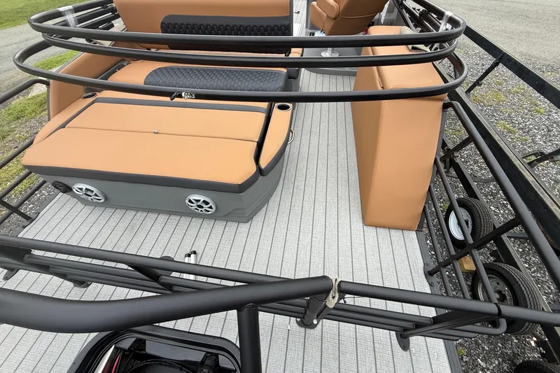 Slide: The Image of 2026 Sylvan L-3 DLZ DH boat interior with tan seating and gray flooring. - 10