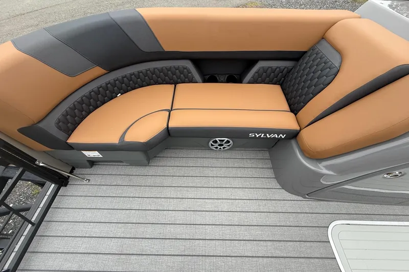 Slide: The Image of 2026 Sylvan L-3 DLZ DH boat interior with tan and black seating. - 12