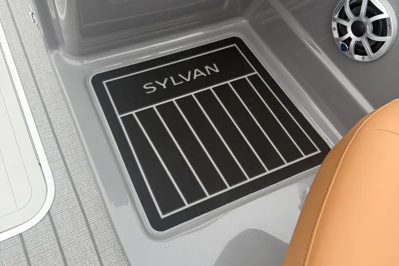 Slide: The Image of 2026 Sylvan L-3 DLZ DH boat interior with branded floor mat and speaker. - 23