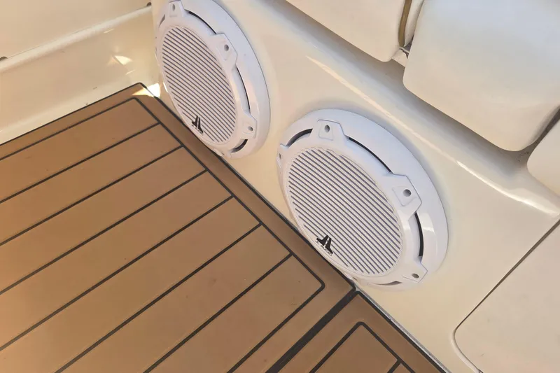 Slide: The Image of 2003 Sea Ray 300 Sundancer boat speakers and deck, showcasing marine audio system. - 12