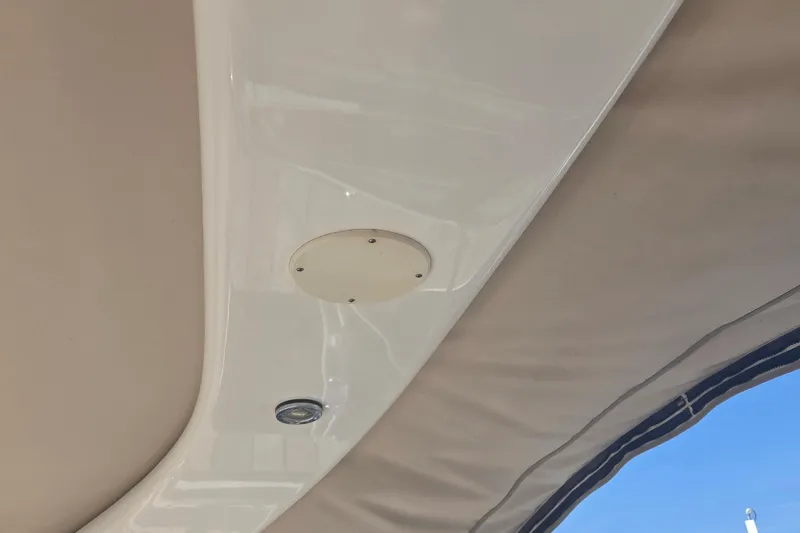 Slide: The Image of Ceiling detail of a 2003 Sea Ray 300 Sundancer boat with light fixture. - 20