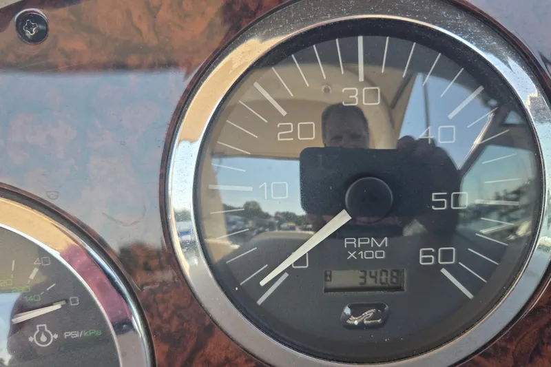 Slide: The Image of Close-up of 2003 Sea Ray 300 Sundancer RPM gauge showing 348 hours. - 34
