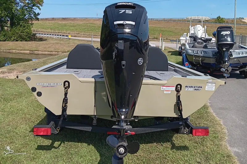 Slide: The Image of 2026 Tracker Pro Team 175 boat with Mercury 75 engine, parked on grass. - 4
