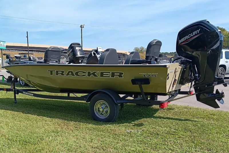 Slide: The Image of 2026 Tracker Pro Team 175 boat with Mercury engine on trailer, parked on grass. - 5