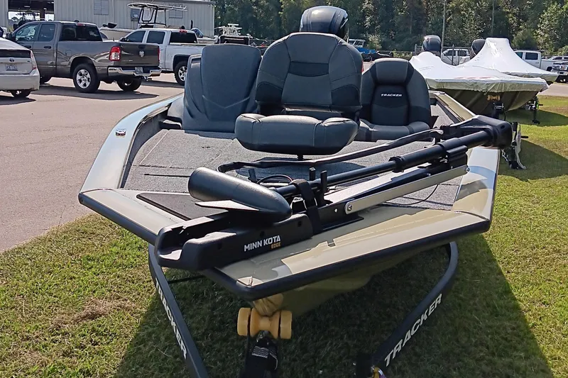 Slide: The Image of 2026 Tracker Pro Team 175 boat with Minn Kota motor, parked on grass. - 7
