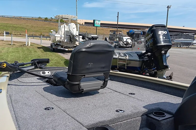 Slide: The Image of 2026 Tracker Pro Team 175 boat with Mercury 250 engine, parked outdoors. - 9