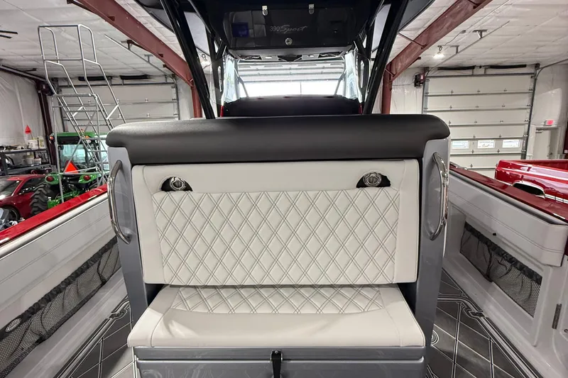 Slide: The Image of 2025 Nor-Tech 390 Sport interior with diamond-stitched seating and sleek design elements. - 22