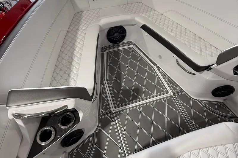 Slide: The Image of Luxurious interior of 2025 Nor-Tech 390 Sport boat with diamond-patterned seating and flooring. - 27
