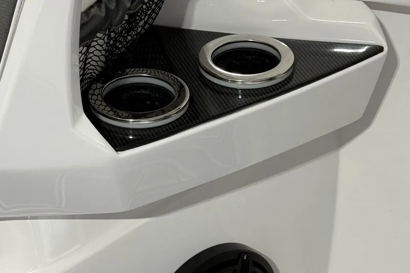 Slide: The Image of 2025 Nor-Tech 390 Sport boat interior with sleek cup holders and carbon fiber accents. - 31