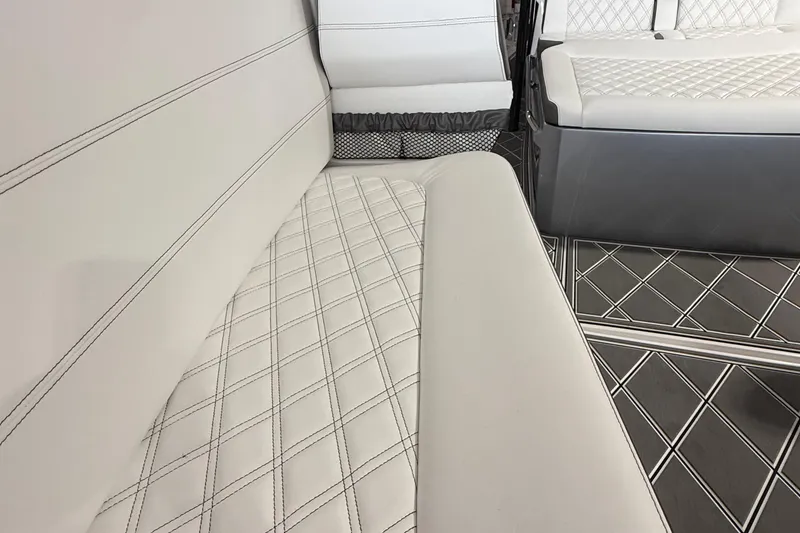 Slide: The Image of Luxurious interior seating of 2025 Nor-Tech 390 Sport boat with diamond-pattern upholstery. - 33