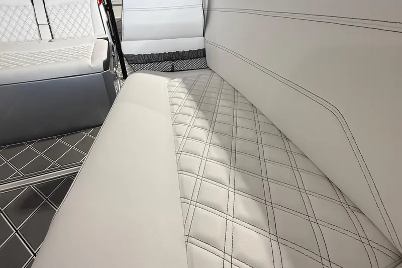 Slide: The Image of Luxurious interior seating of 2025 Nor-Tech 390 Sport with diamond-stitched upholstery. - 34