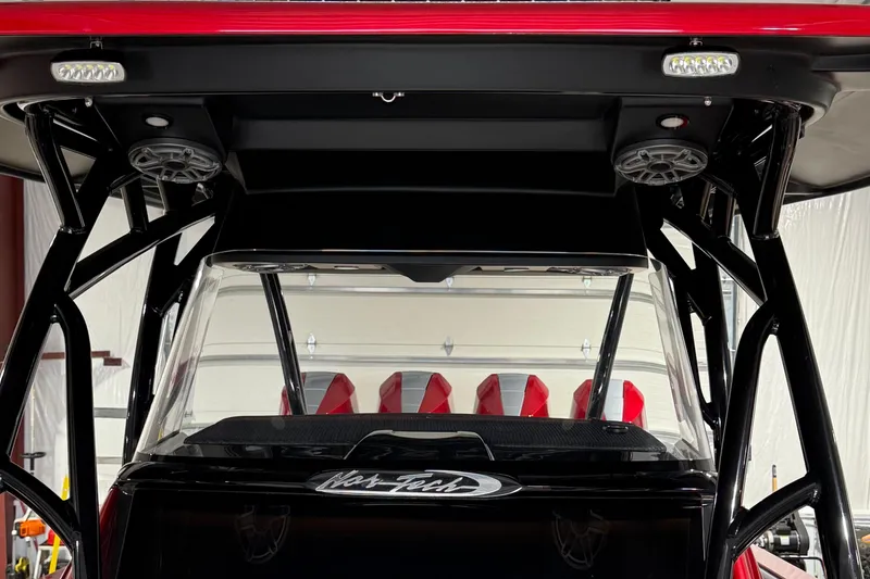 Slide: The Image of 2025 Nor-Tech 390 Sport boat interior with red seats and modern design. - 35