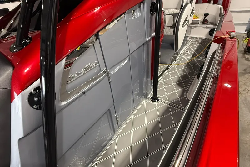 Slide: The Image of 2025 Nor-Tech 390 Sport boat interior with red accents and sleek design. - 36
