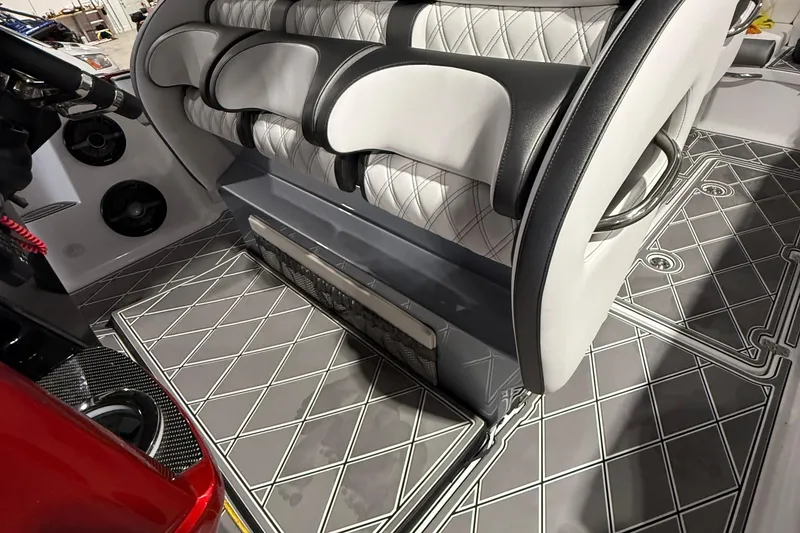 Slide: The Image of Interior of 2025 Nor-Tech 390 Sport boat with stylish seating and patterned flooring. - 37