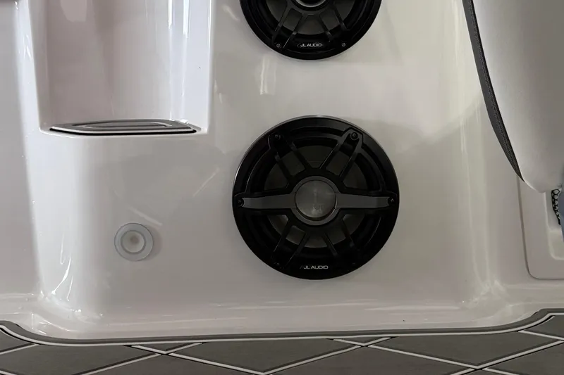 Slide: The Image of 2025 Nor-Tech 390 Sport boat featuring JL Audio speakers on white interior. - 48