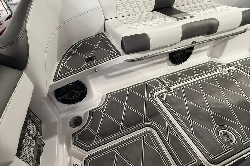 Slide: The Image of 2025 Nor-Tech 390 Sport interior with diamond-patterned seating and flooring. - 49