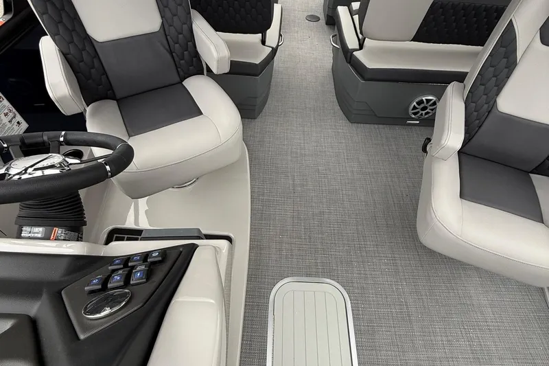Slide: The Image of Interior of 2026 Sylvan L-3 RLZ DH boat with modern seating and steering console. - 10