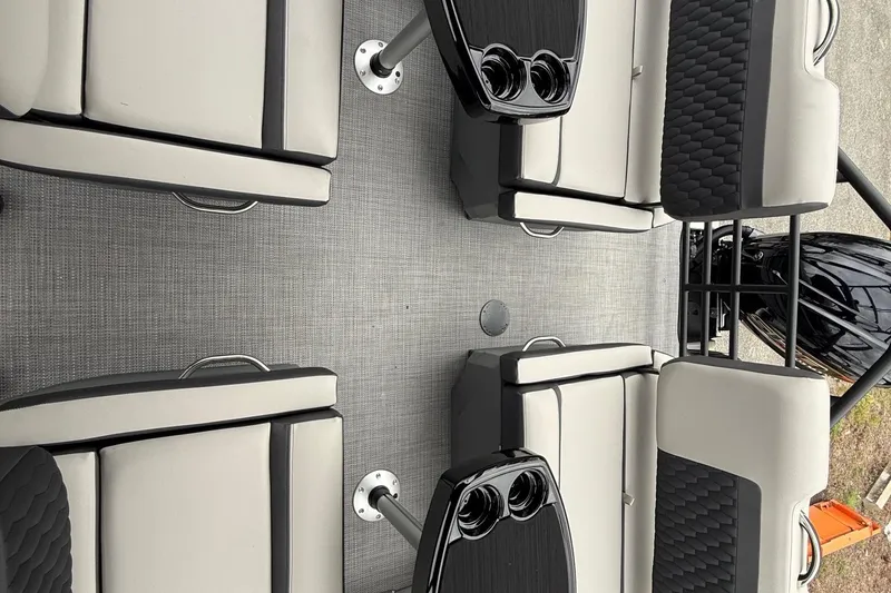 Slide: The Image of 2026 Sylvan L-3 RLZ DH boat interior with gray seating and cup holders. - 14