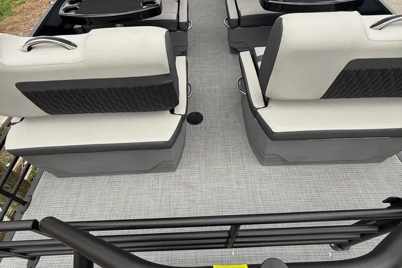 Slide: The Image of 2026 Sylvan L-3 RLZ DH boat interior with gray seating and flooring. - 18