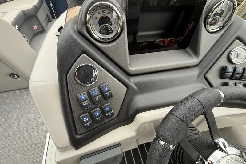 Slide: The Image of Control panel of 2026 Sylvan L-3 RLZ DH boat with steering wheel and gauges. - 20