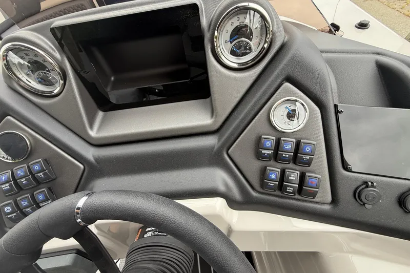 Slide: The Image of Control panel of 2026 Sylvan L-3 RLZ DH boat with gauges and buttons. - 21