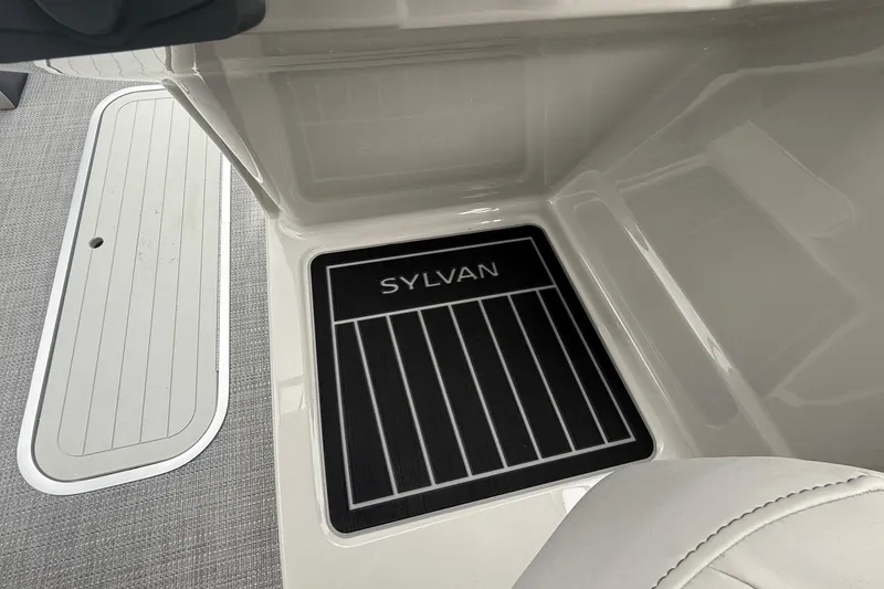 Slide: The Image of 2026 Sylvan L-3 RLZ DH boat interior with branded floor mat. - 22