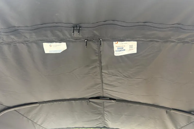 Slide: The Image of Interior view of Sylvan L-3 RLZ DH 2026 Bimini extension with zippers and labels. - 27