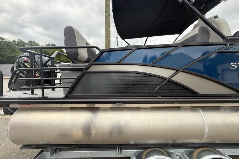 Slide: The Image of 2026 Sylvan L-3 RLZ DH pontoon boat, side view with seating and railing. - 3