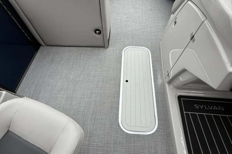 Slide: The Image of Interior of 2026 Sylvan L-3 RLZ DH boat with sleek flooring and seating. - 30
