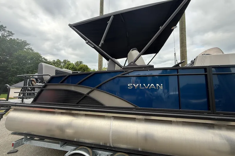 Slide: The Image of 2026 Sylvan L-3 RLZ DH pontoon boat with canopy, side view. - 6