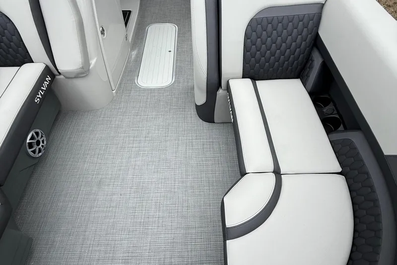 Slide: The Image of 2026 Sylvan L-3 RLZ DH boat interior with gray seating and flooring. - 7