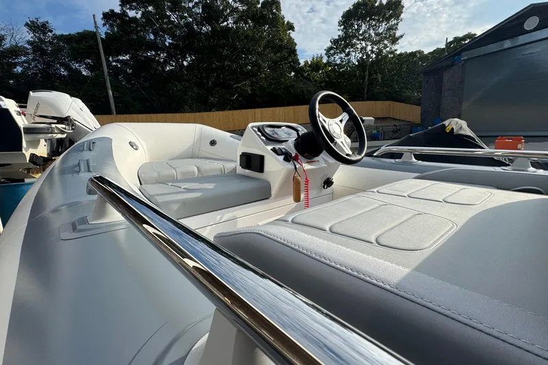Slide: The Image of 2024 Williams Jet Tenders Sportjet 345 interior with sleek design and modern steering console. - 6