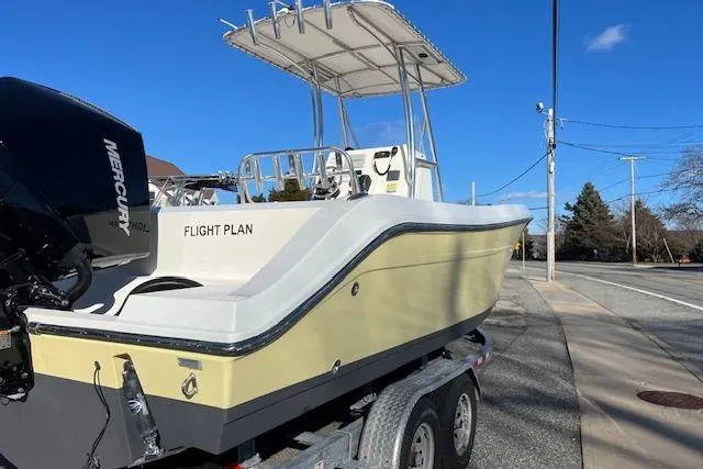 Slide: The Image of 2020 Cobia 237 Center Console boat on trailer, featuring Mercury outboard engine. - 5